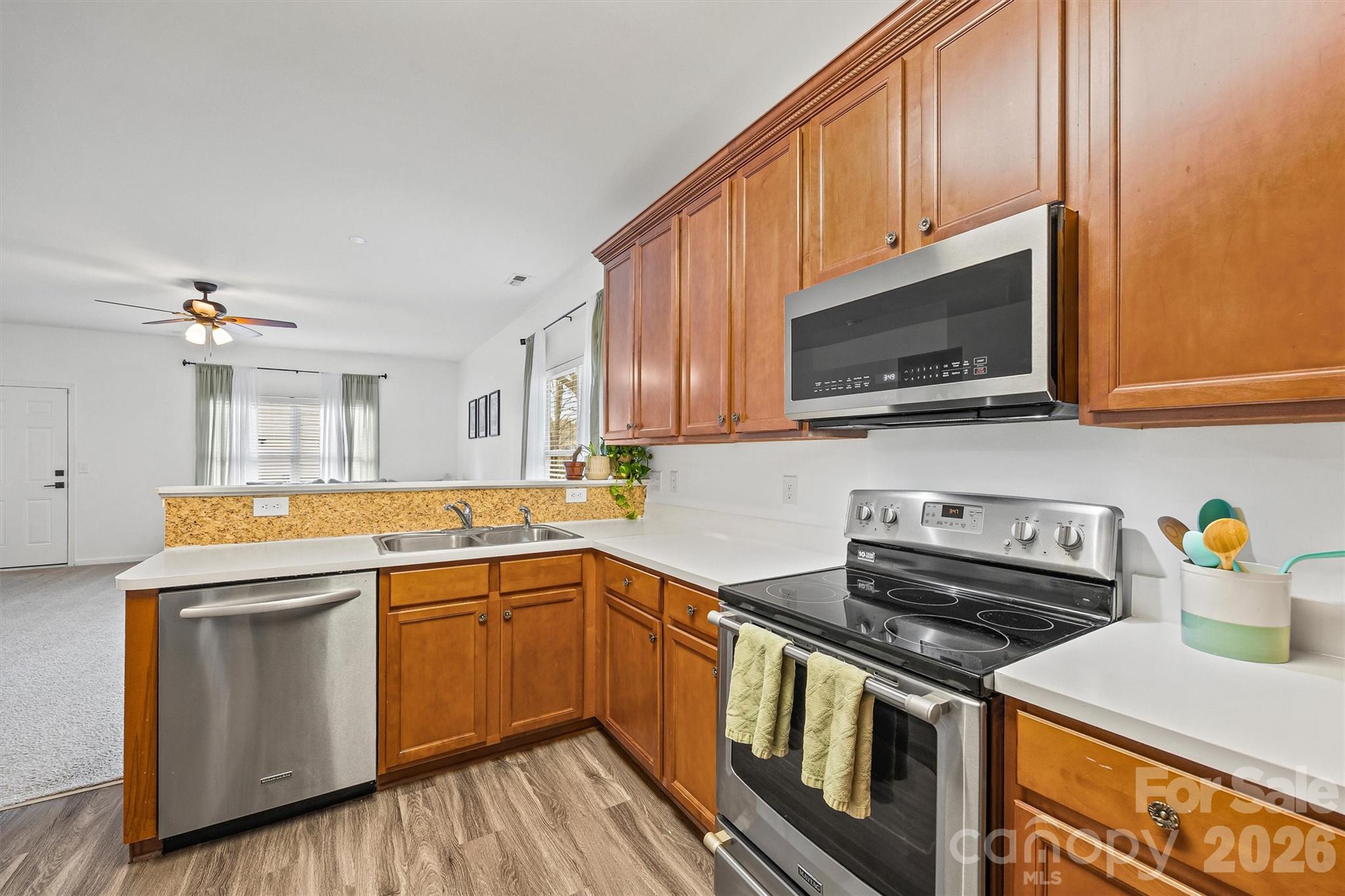 2133 Seabrook Lane Fort Mill, SC 29715 - Photo 8 of 28 a kitchen with a sink a stove and cabinets