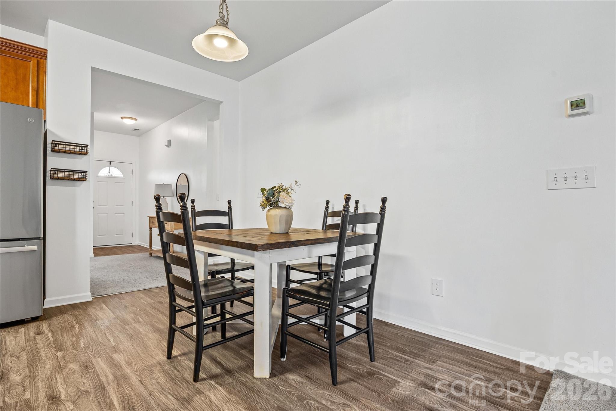 2133 Seabrook Lane Fort Mill, SC 29715 - Photo 9 of 28 a view of a dining room with furniture and wooden floor