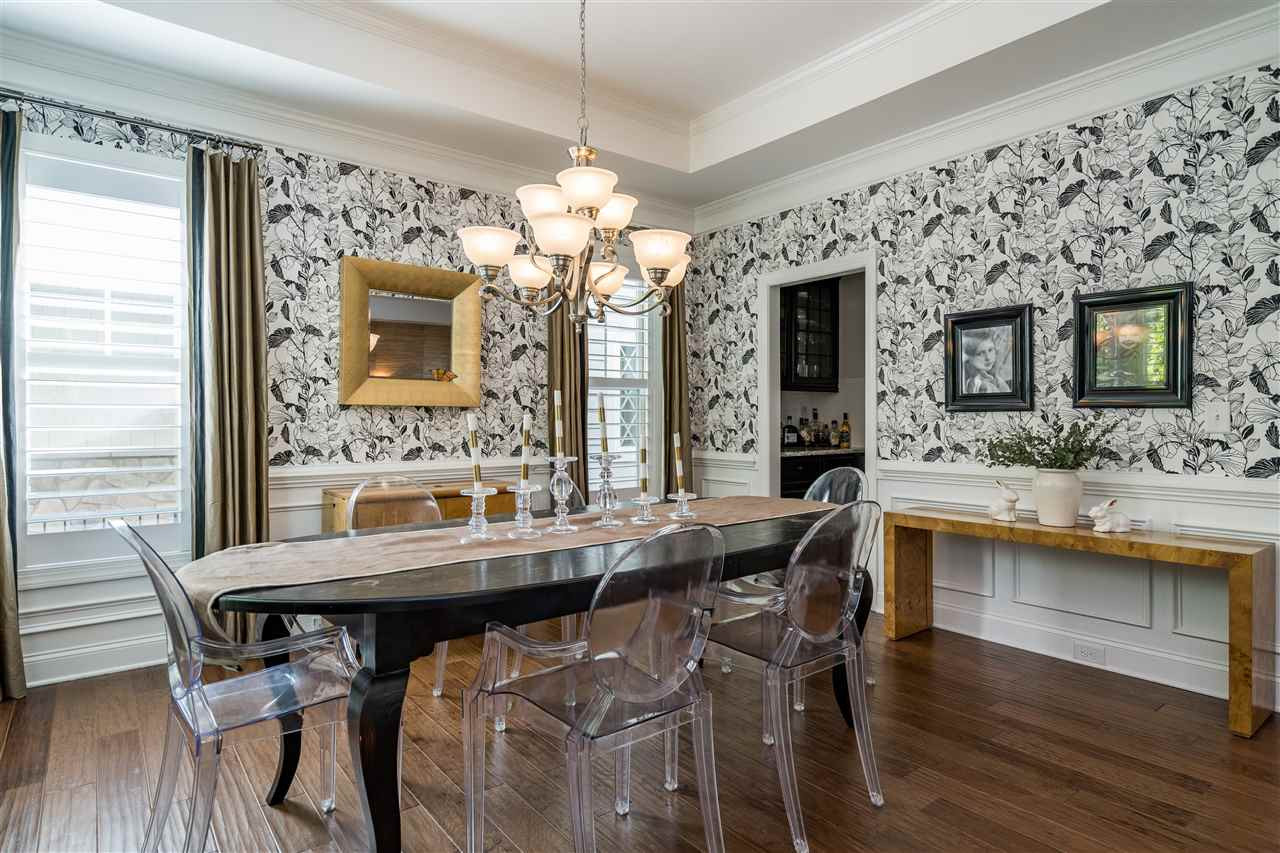 1400 Van Page Boulevard Raleigh, NC 27607 - Photo 9 of 30 Shutters, chandelier, tray ceiling, wainscoting, all leading to the butler's pantry. Dining Room