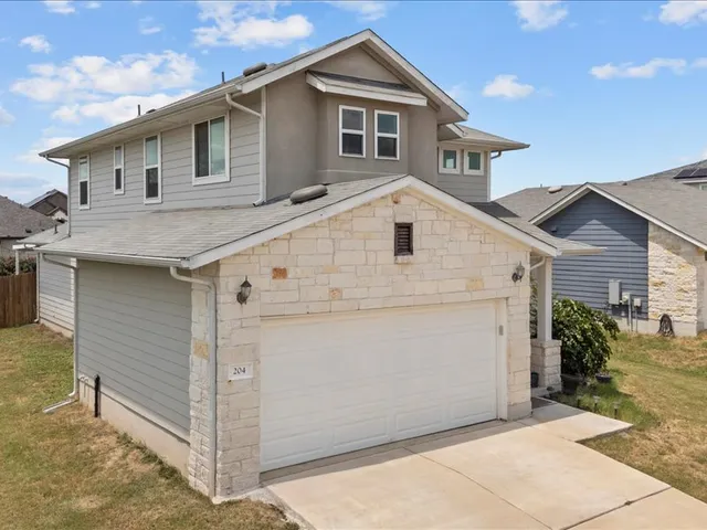 a view of a house with a garage