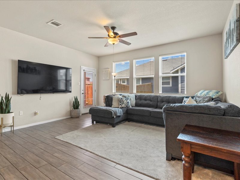 204 Lake Placid Run Elgin, TX 78621 - Photo 6 of 19 a living room with furniture and a flat screen tv