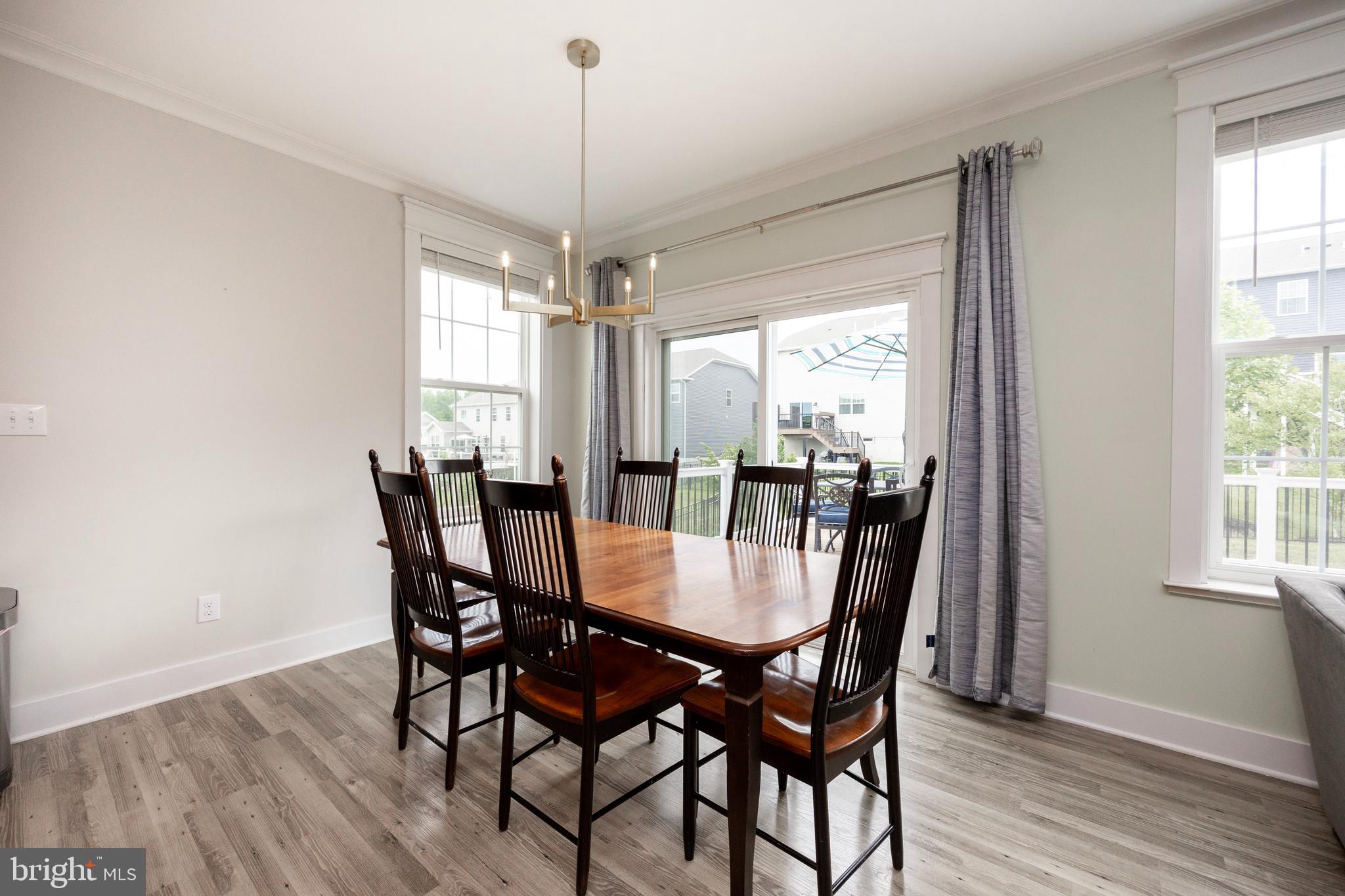 45 Nichols Mill Road Downingtown, PA 19335 - Photo 12 of 47 a view of a dining room with furniture window and wooden floor