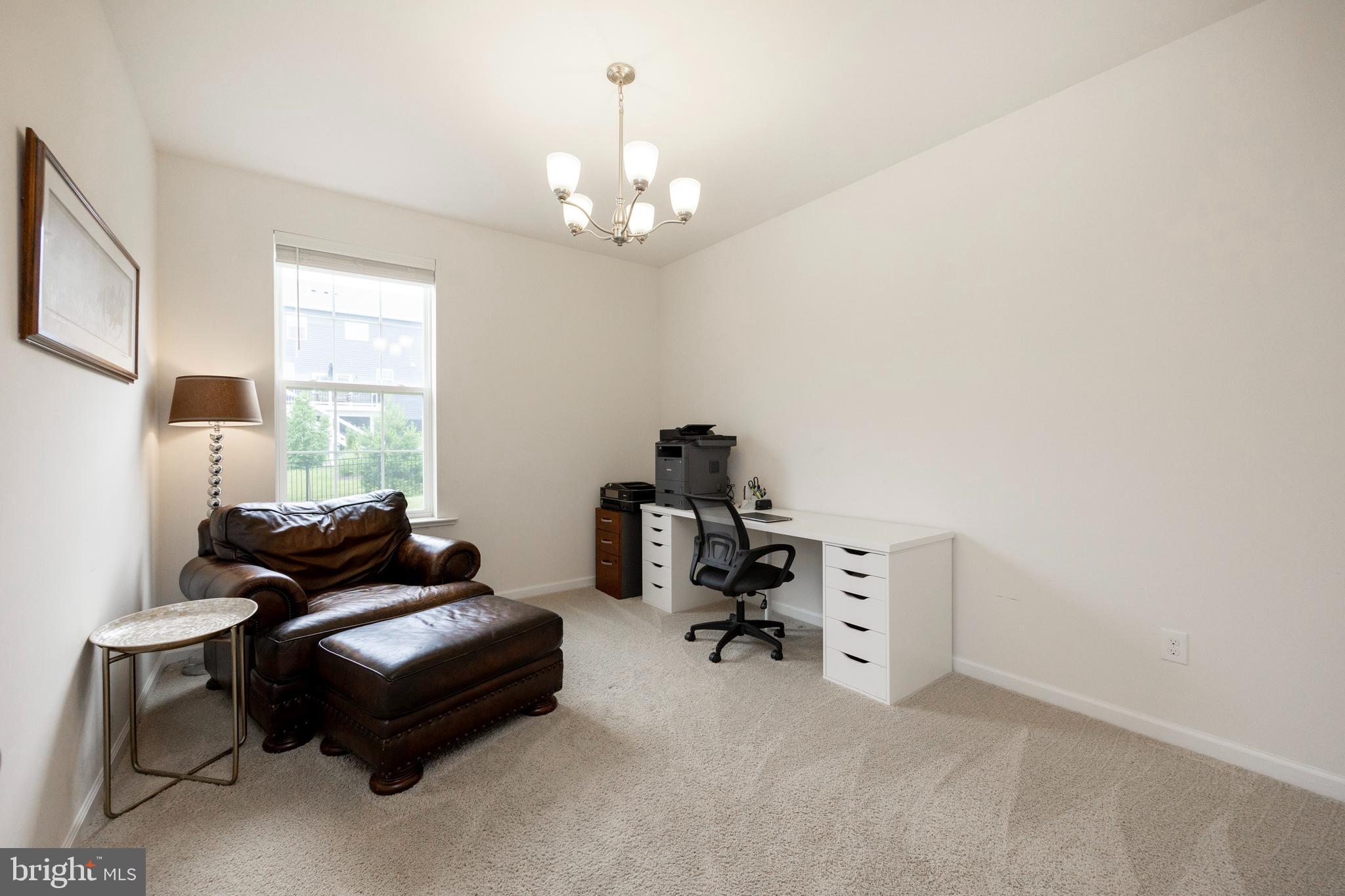 45 Nichols Mill Road Downingtown, PA 19335 - Photo 16 of 47 a living room with furniture and a chandelier
