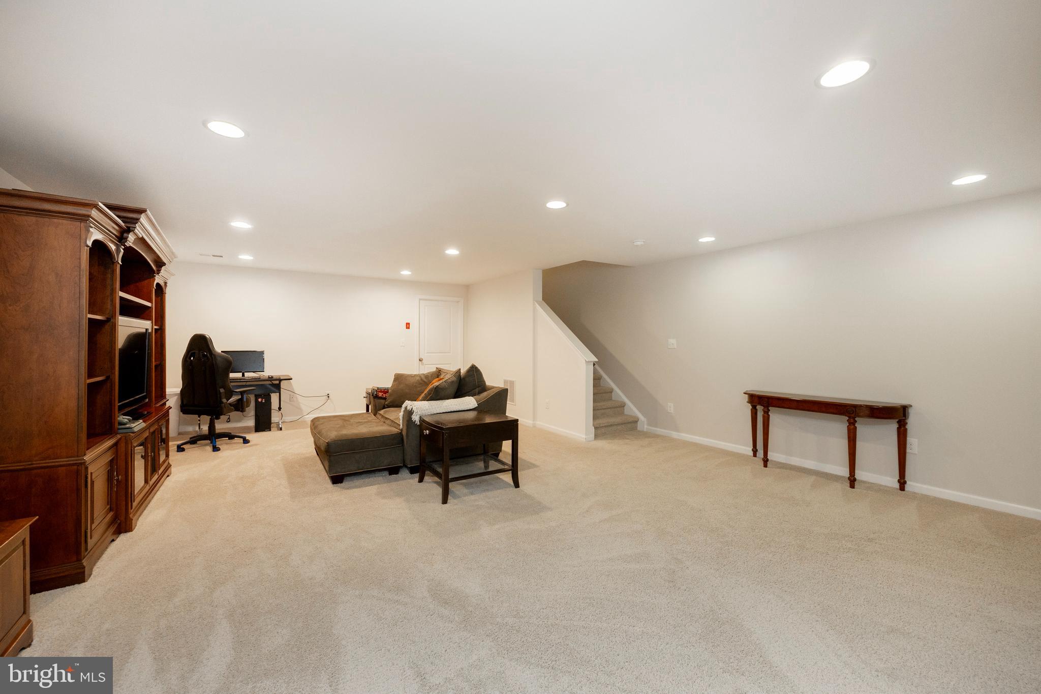45 Nichols Mill Road Downingtown, PA 19335 - Photo 18 of 47 a living room with furniture and a flat screen tv