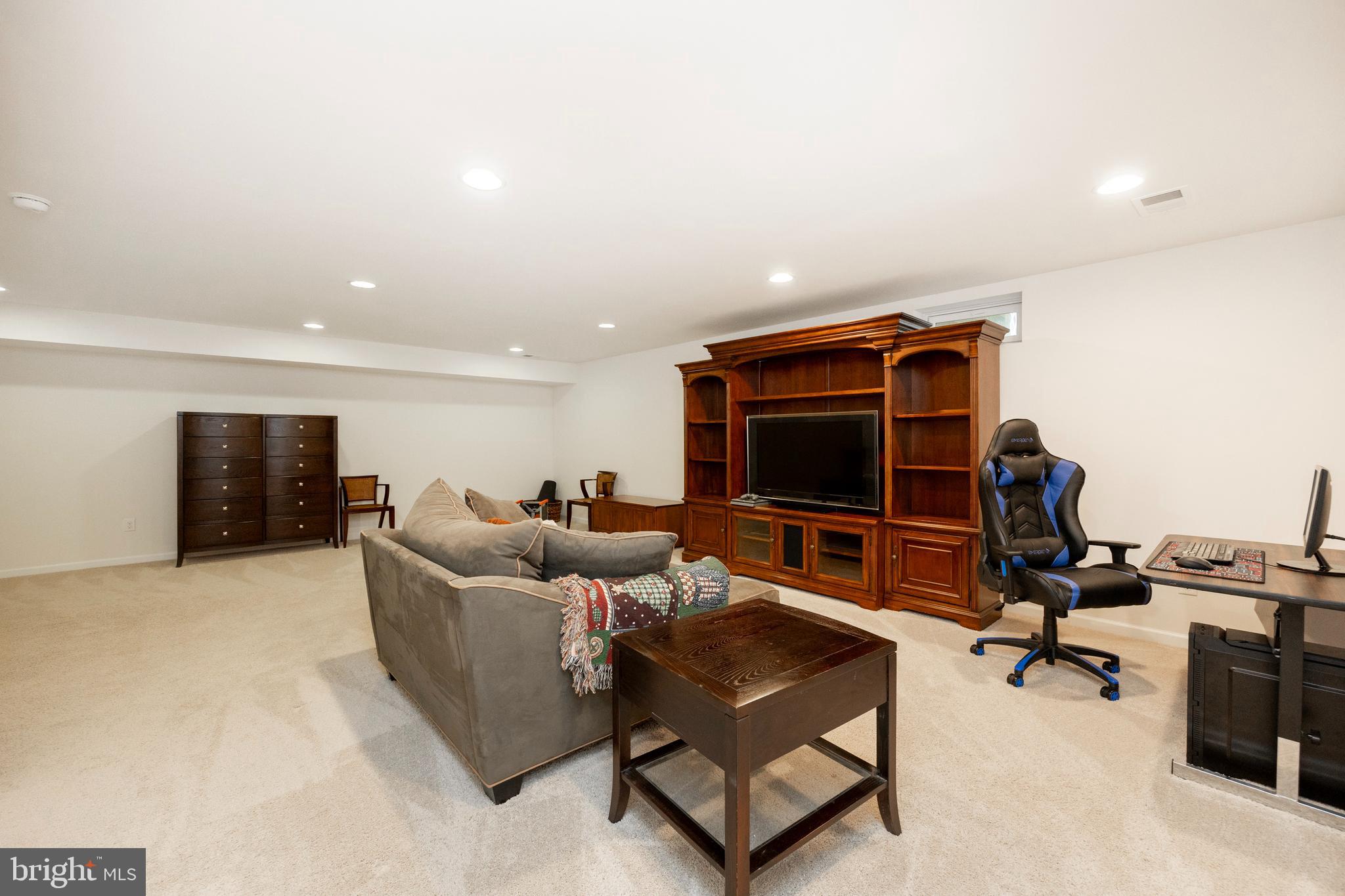 45 Nichols Mill Road Downingtown, PA 19335 - Photo 20 of 47 a living room with furniture and a flat screen tv