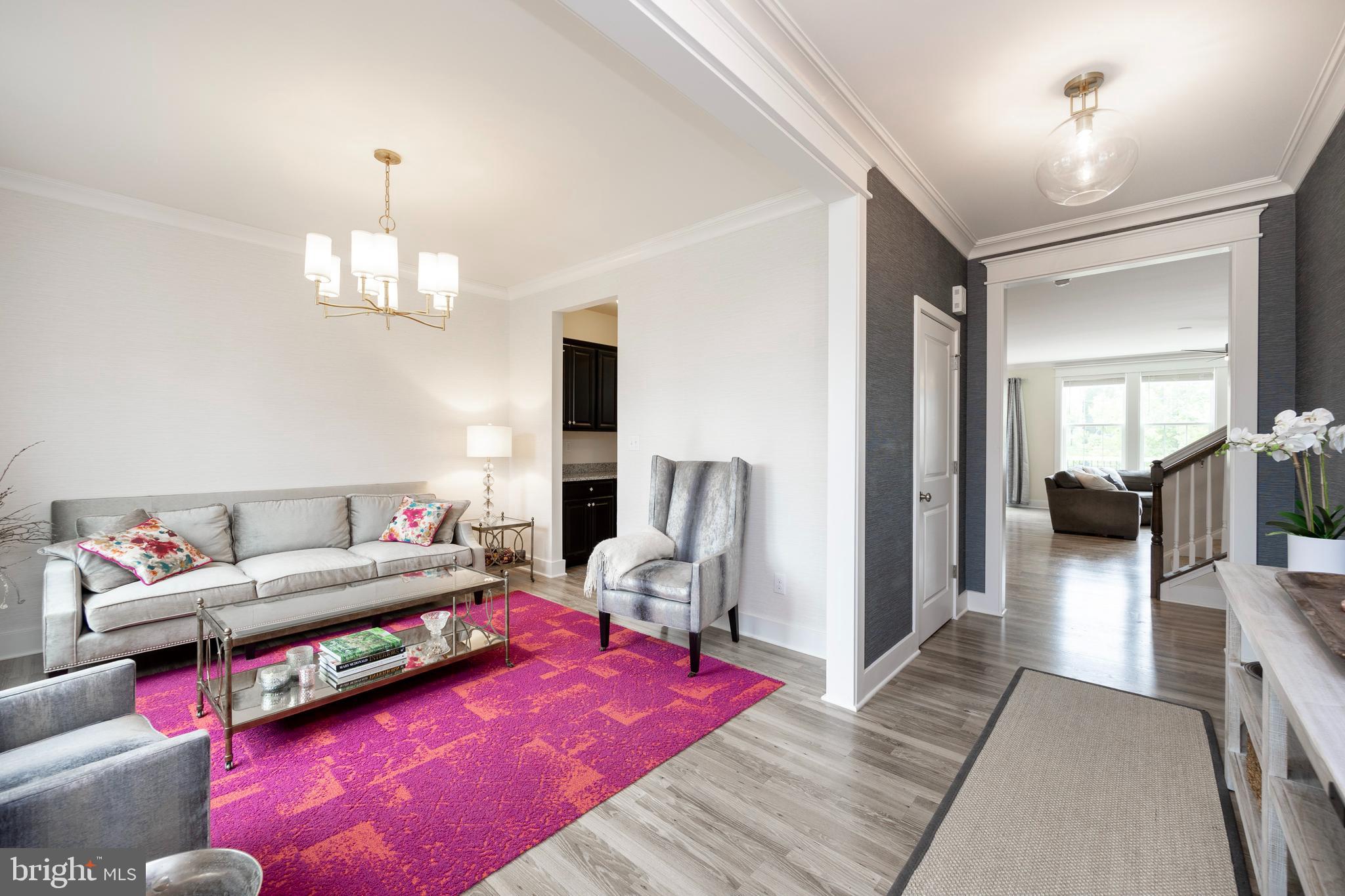 45 Nichols Mill Road Downingtown, PA 19335 - Photo 2 of 47 a living room with furniture and a chandelier