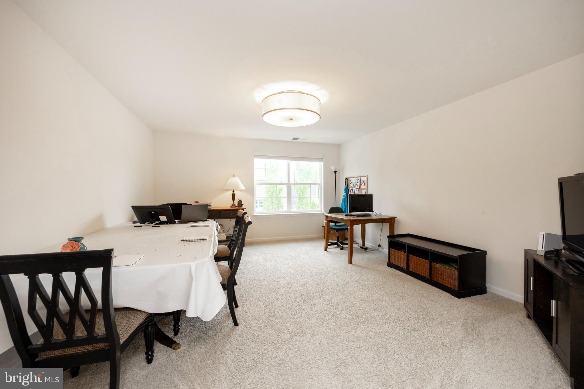 45 Nichols Mill Road Downingtown, PA 19335 - Photo 25 of 47 a living room with furniture and a window