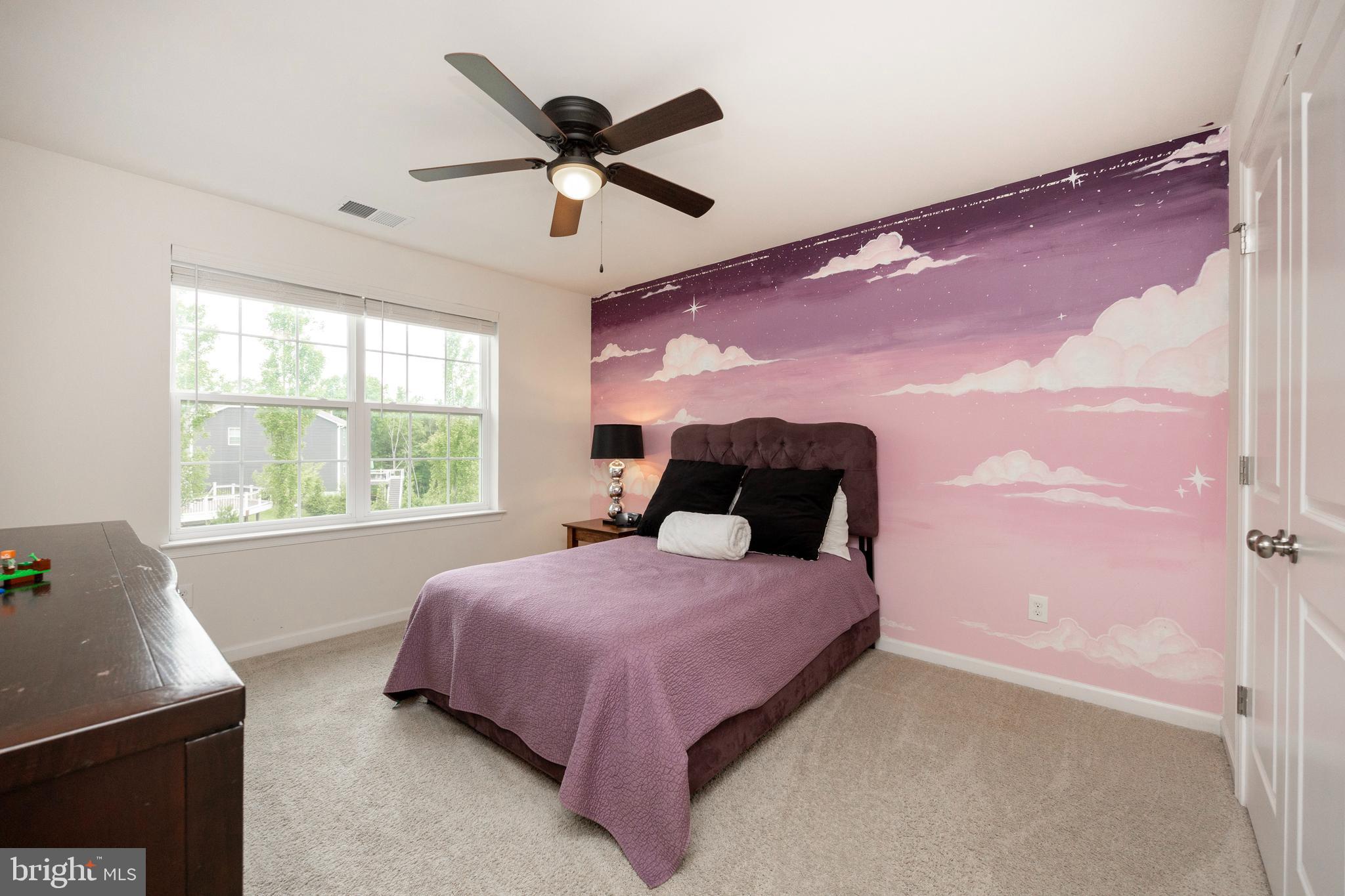 45 Nichols Mill Road Downingtown, PA 19335 - Photo 28 of 47 a bedroom with a bed and a large window