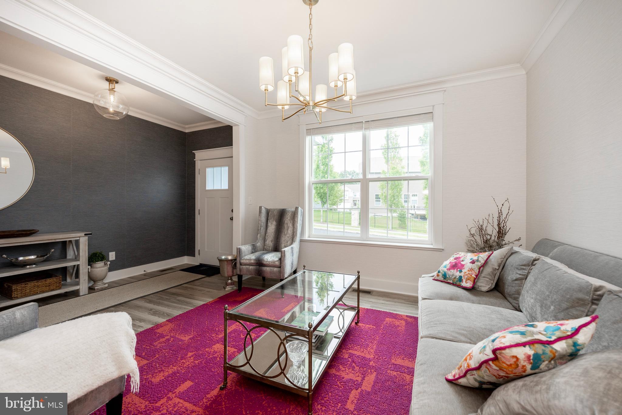45 Nichols Mill Road Downingtown, PA 19335 - Photo 3 of 47 a living room with furniture and a chandelier
