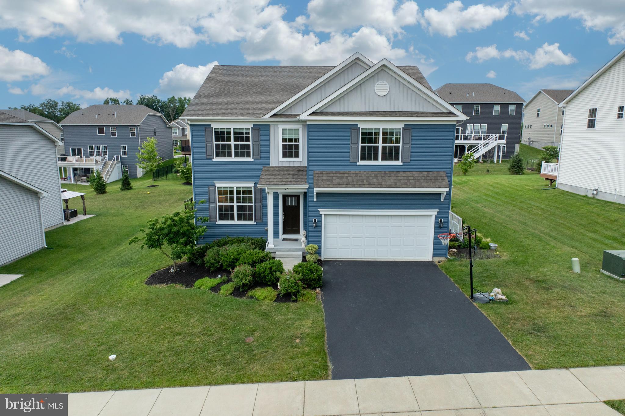 45 Nichols Mill Road Downingtown, PA 19335 - Photo 35 of 47 a front view of a house with a yard