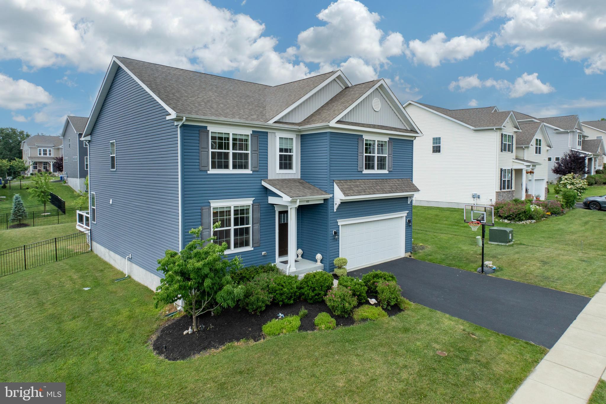 45 Nichols Mill Road Downingtown, PA 19335 - Photo 37 of 47 a front view of a house with garden