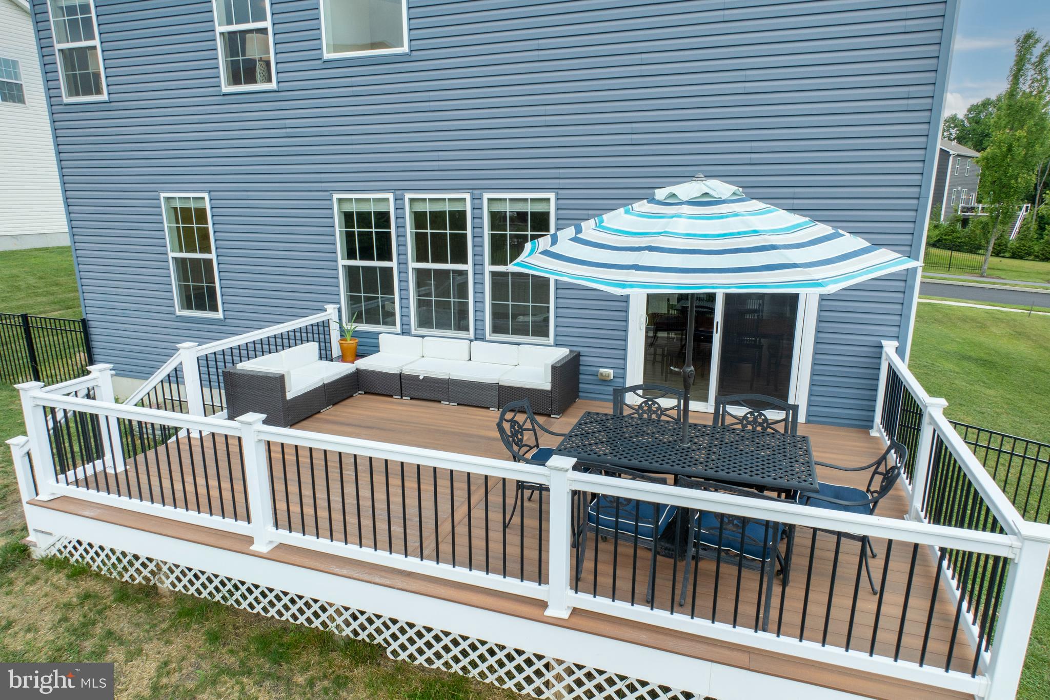 45 Nichols Mill Road Downingtown, PA 19335 - Photo 39 of 47 a view of a house with a small deck and a large window