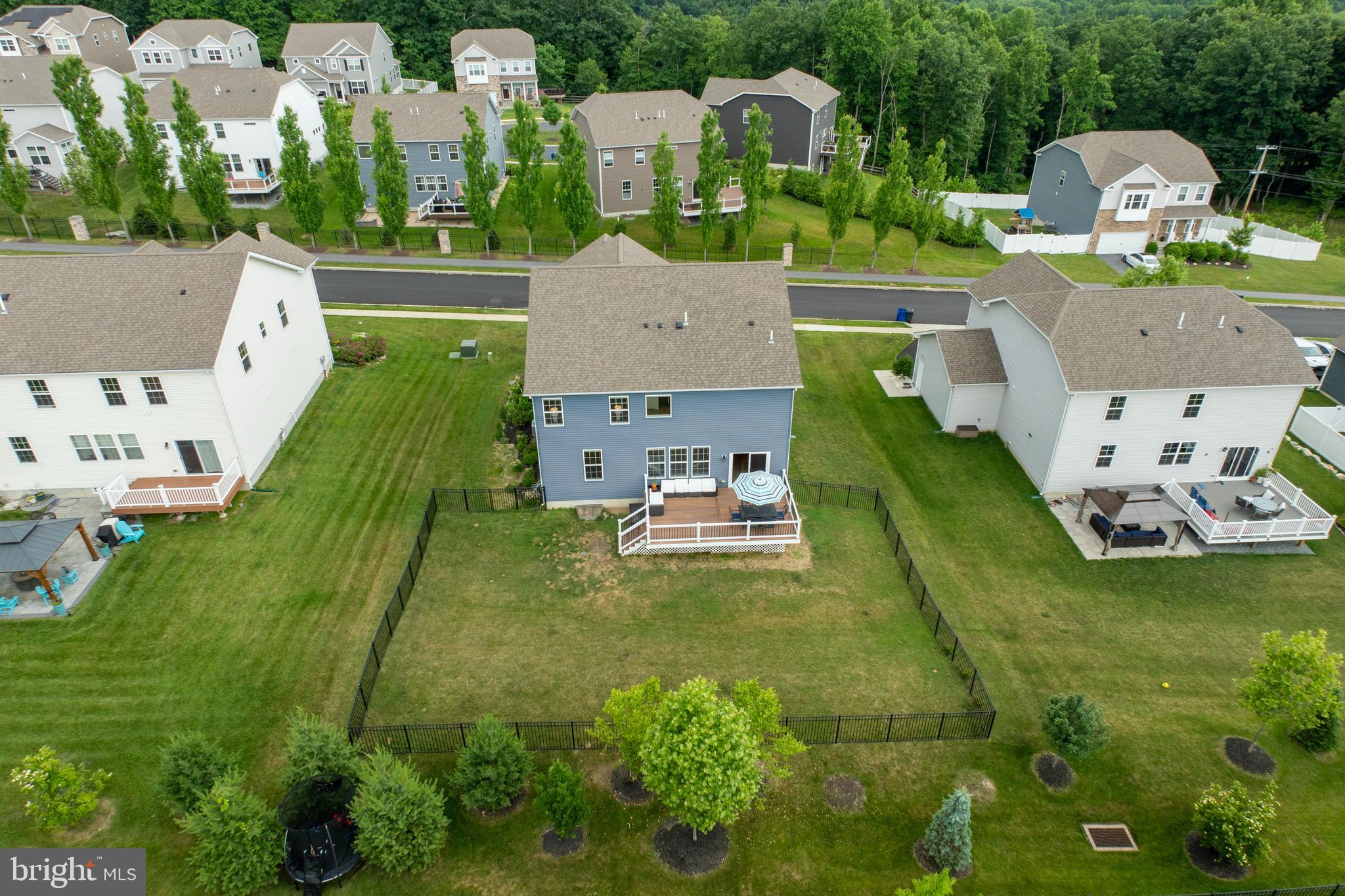 45 Nichols Mill Road Downingtown, PA 19335 - Photo 40 of 47 an aerial view of a house with swimming pool lawn chairs and yard