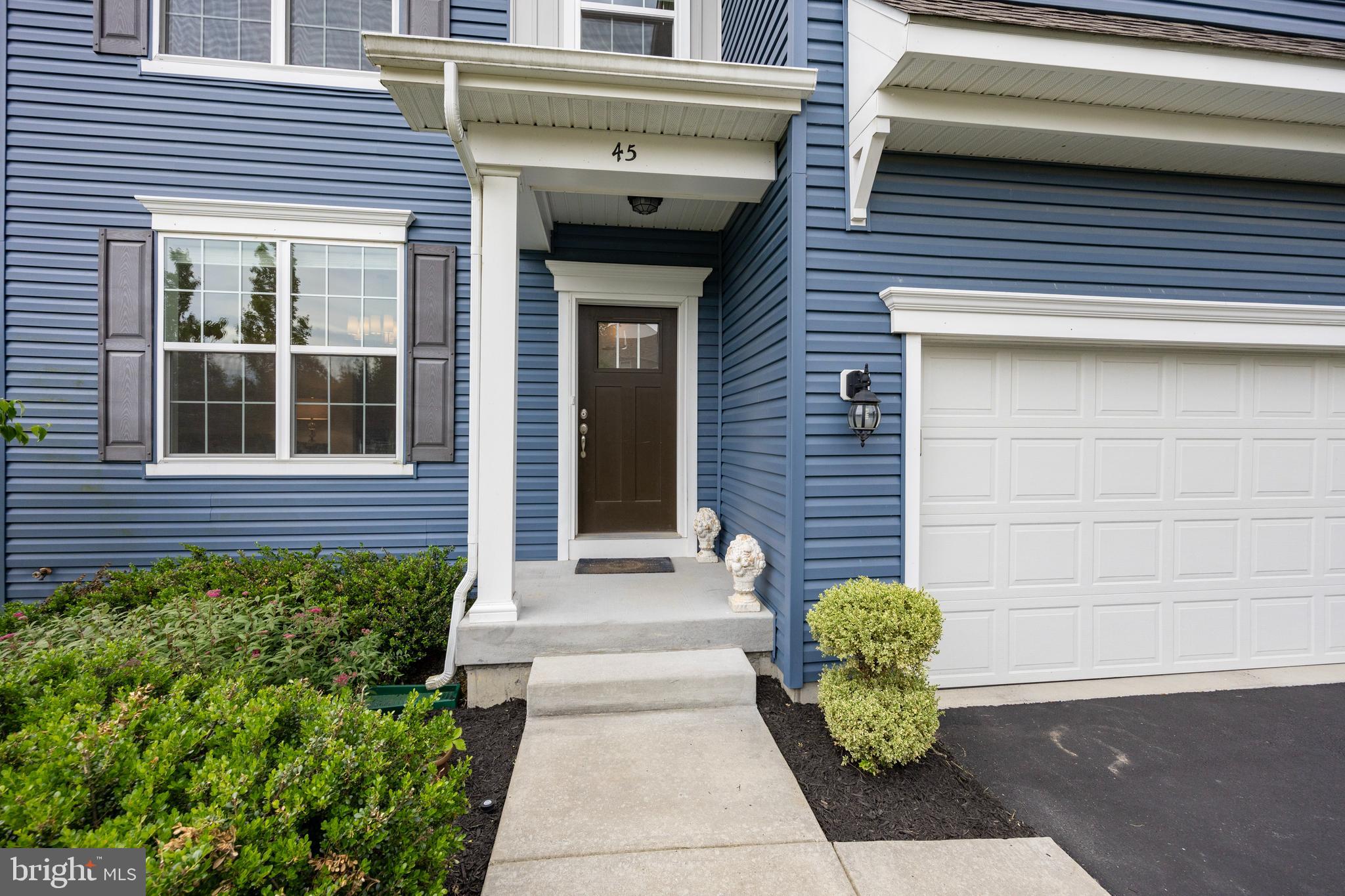 45 Nichols Mill Road Downingtown, PA 19335 - Photo 44 of 47 a front view of a house with a garden