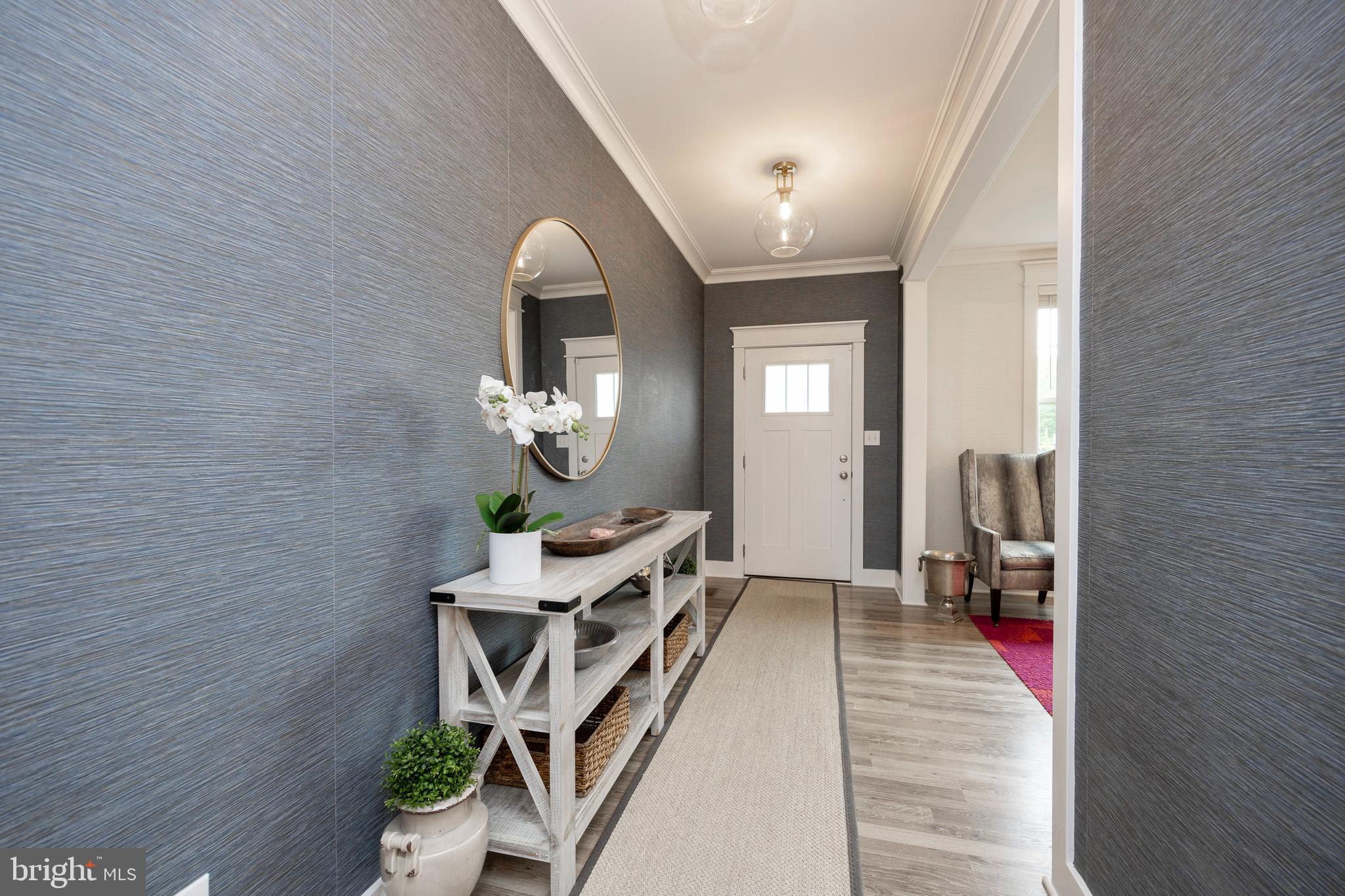 45 Nichols Mill Road Downingtown, PA 19335 - Photo 6 of 47 a hallway with a wooden floor and a potted plant