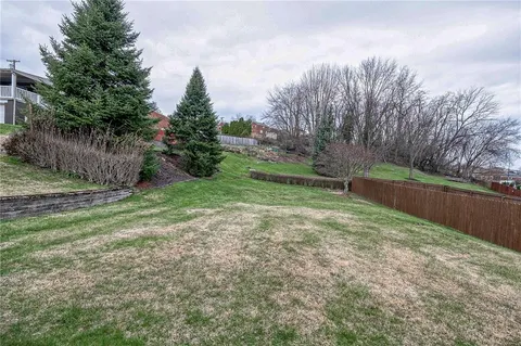 a view of backyard with green space