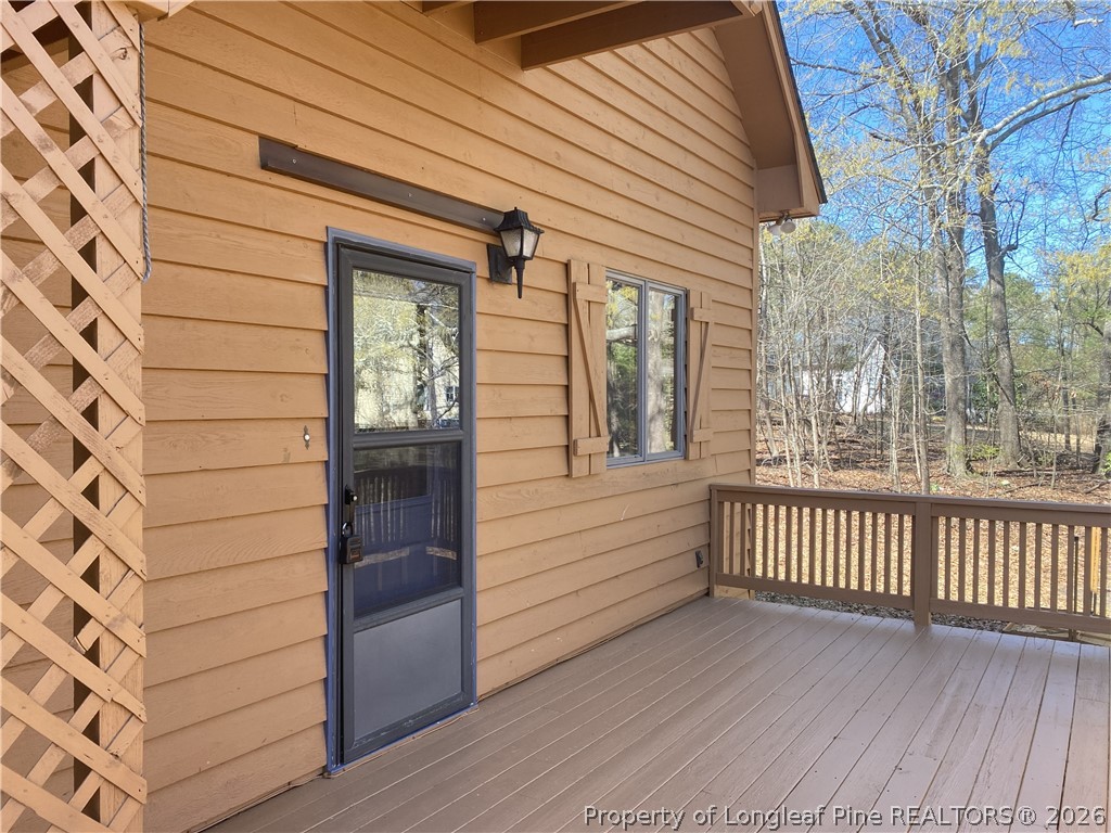 45 Lookout Point Sanford, NC 27332 - Photo 12 of 15 a view of a porch with wooden floor and fence