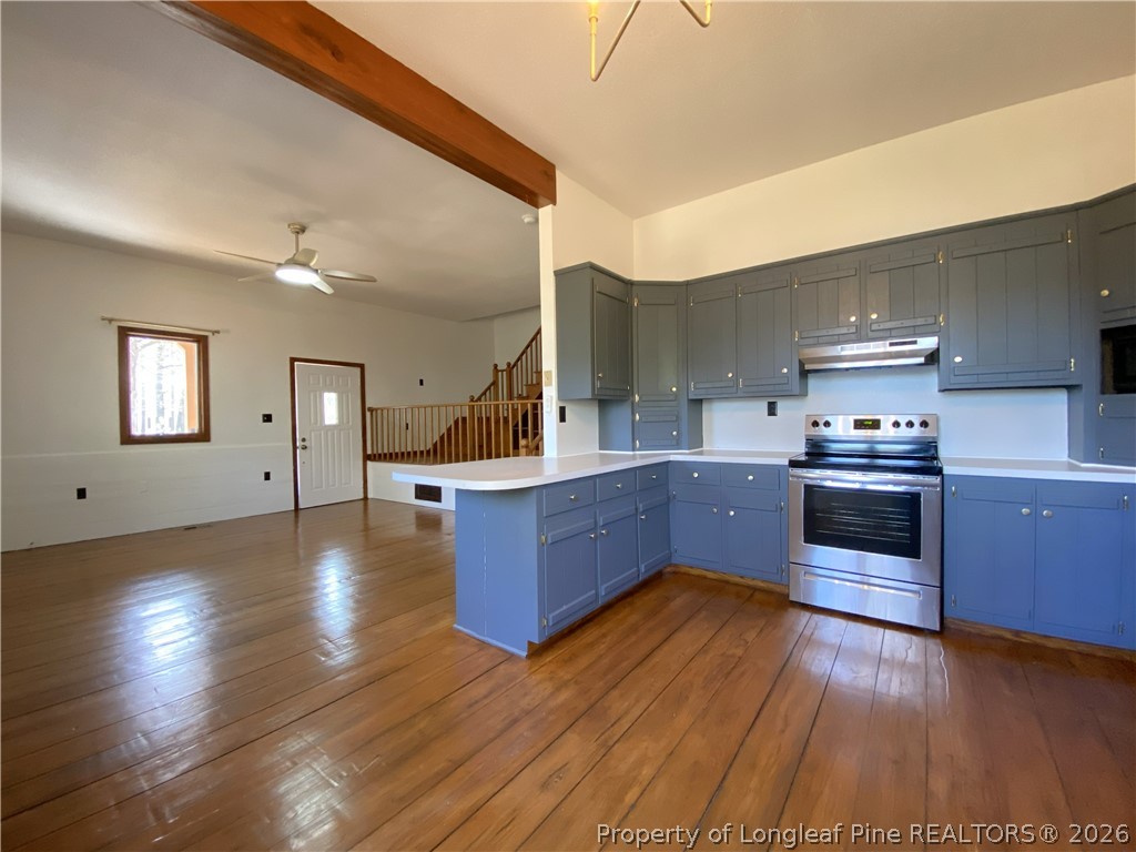 45 Lookout Point Sanford, NC 27332 - Photo 5 of 15 a kitchen with stainless steel appliances kitchen island wooden cabinets and granite counter tops