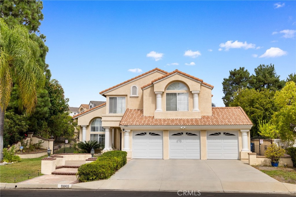 19803 Moon Shadow Circle Walnut, CA 91789 - Photo 1 of 1 a view of a house with a yard and potted plants