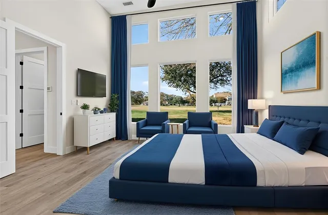 a bathroom with a granite countertop sink two mirror and shower