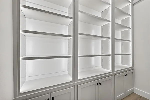a view of white cabinets and a sink