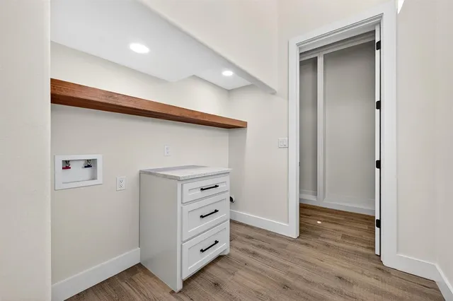 a bathroom with a granite countertop sink a toilet and a mirror