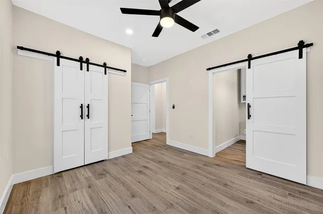 a bathroom with a granite countertop sink a toilet and a bathtub