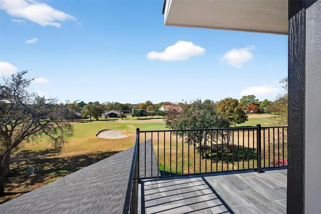 a view of a balcony with wooden floor and outdoor space