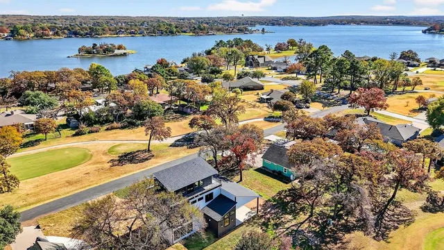 an aerial view of ocean residential houses with outdoor space and seating
