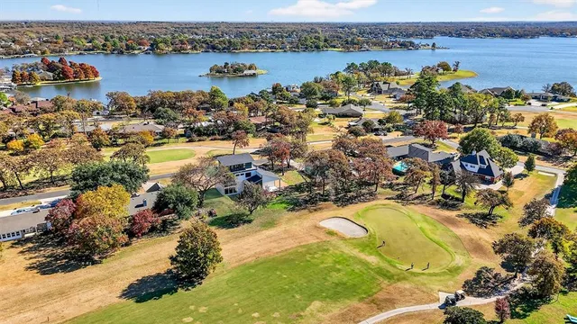 a view of a house with swimming pool and sitting area