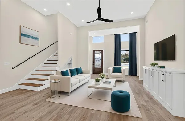 a living room with fireplace furniture and a flat screen tv