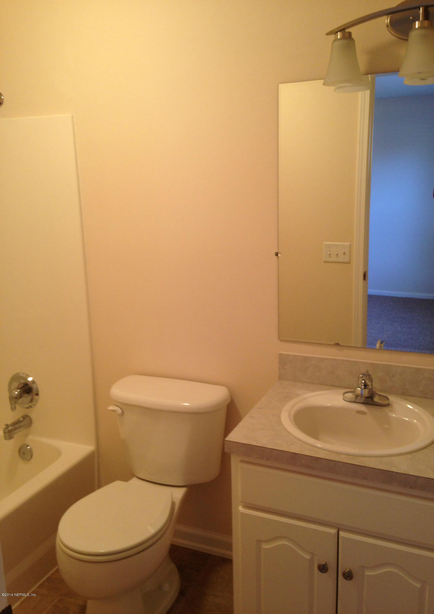 44206 Quail Rdg Drive Callahan, FL 32011 - Photo 10 of 17 a bathroom with a sink a toilet and shower