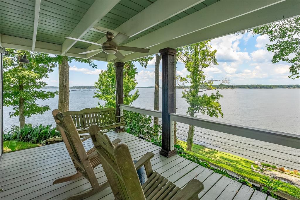 128 Knott Drive Many, LA 71449 - Photo 1 of 39 a view of balcony with wooden floor and outdoor seating