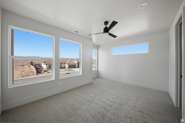 3011 East Rimrunner Drive, Unit 302 St. George, UT 84790 - Photo 37 of 45 Empty room with light carpet, ceiling fan, plenty of natural light, and recessed lighting
