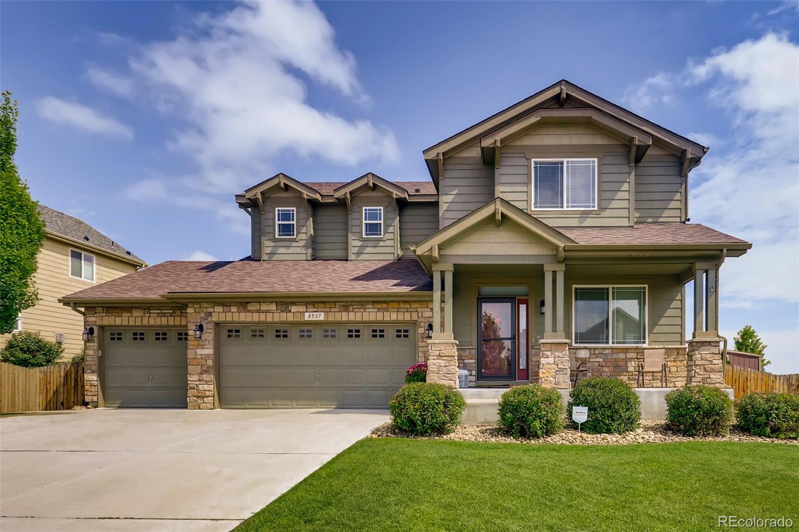 8537 Raspberry Drive Frederick, CO 80504 - Photo 1 of 31 a front view of a house with garden