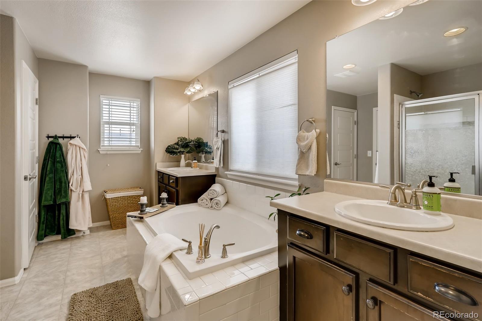 8537 Raspberry Drive Frederick, CO 80504 - Photo 14 of 31 a bathroom with a sink double vanity and a mirror