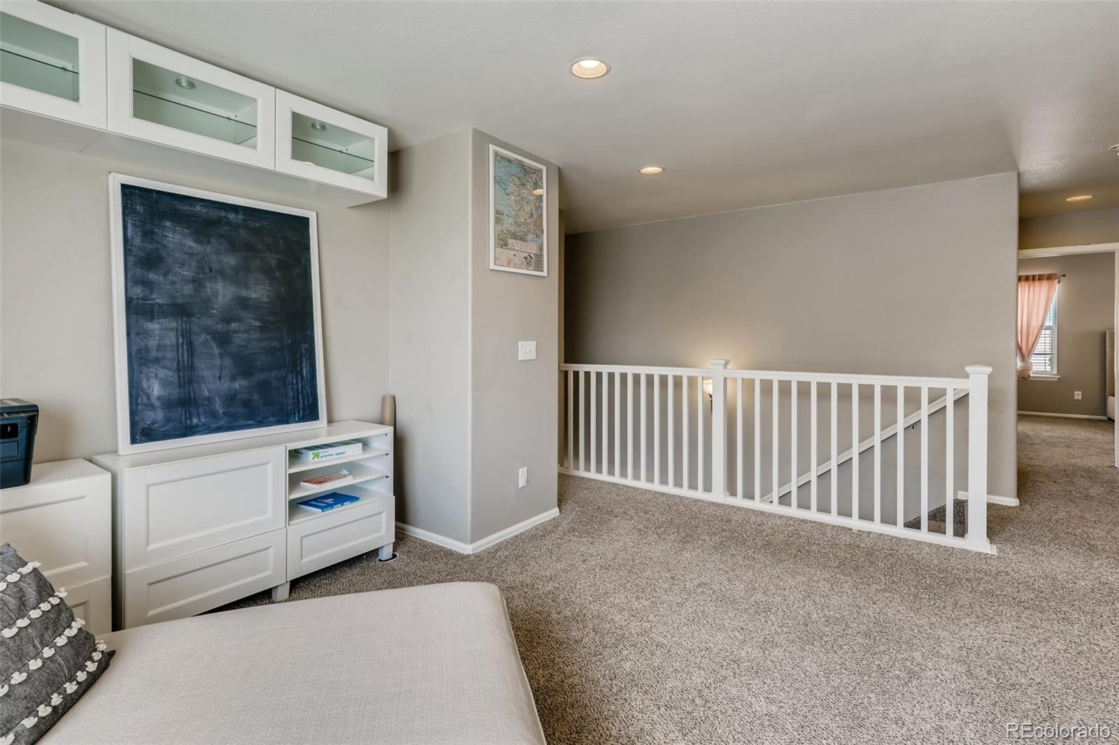 8537 Raspberry Drive Frederick, CO 80504 - Photo 19 of 31 a view of room with furniture and windows