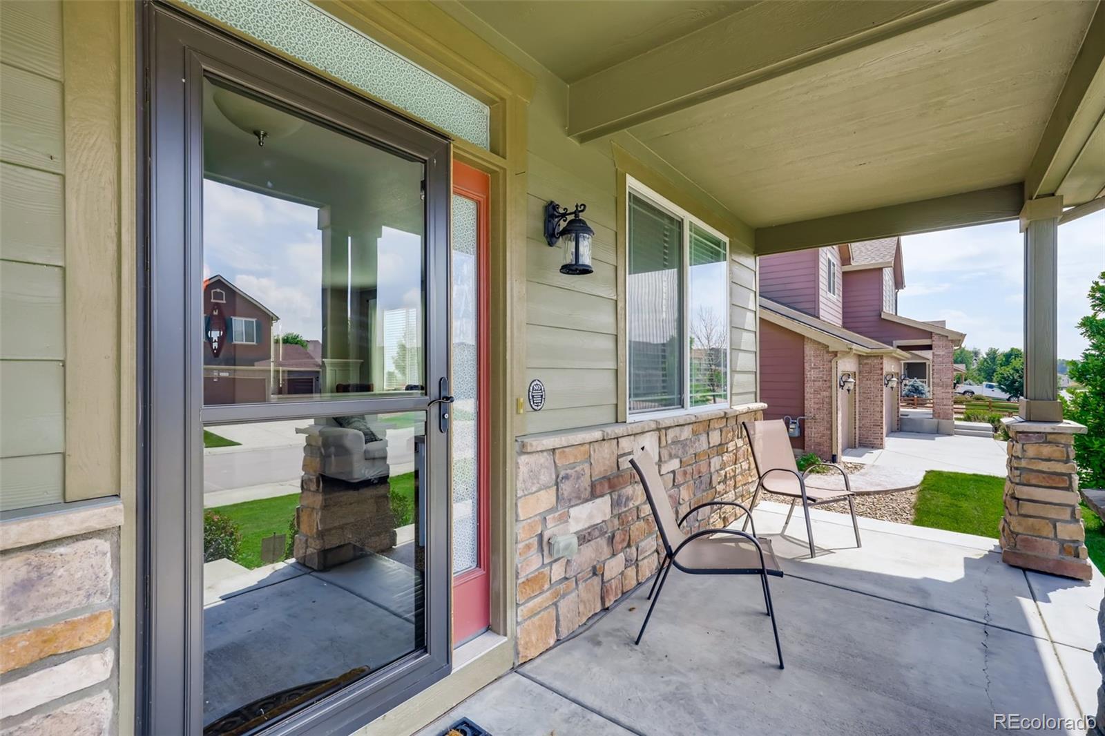 8537 Raspberry Drive Frederick, CO 80504 - Photo 2 of 31 a patio with table and chairs