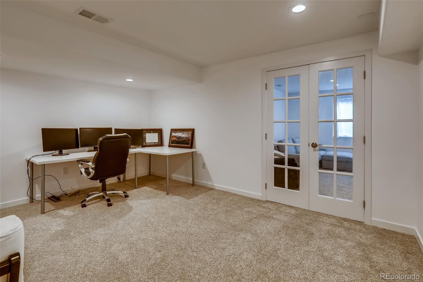 8537 Raspberry Drive Frederick, CO 80504 - Photo 22 of 31 a view of a workspace with furniture and a window