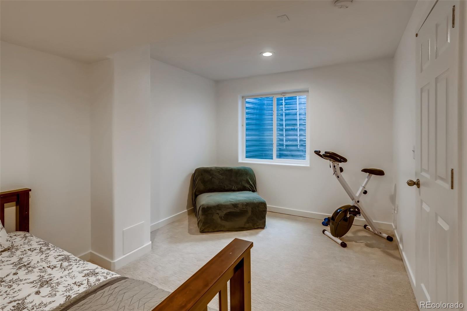 8537 Raspberry Drive Frederick, CO 80504 - Photo 23 of 31 a bedroom with furniture and a window