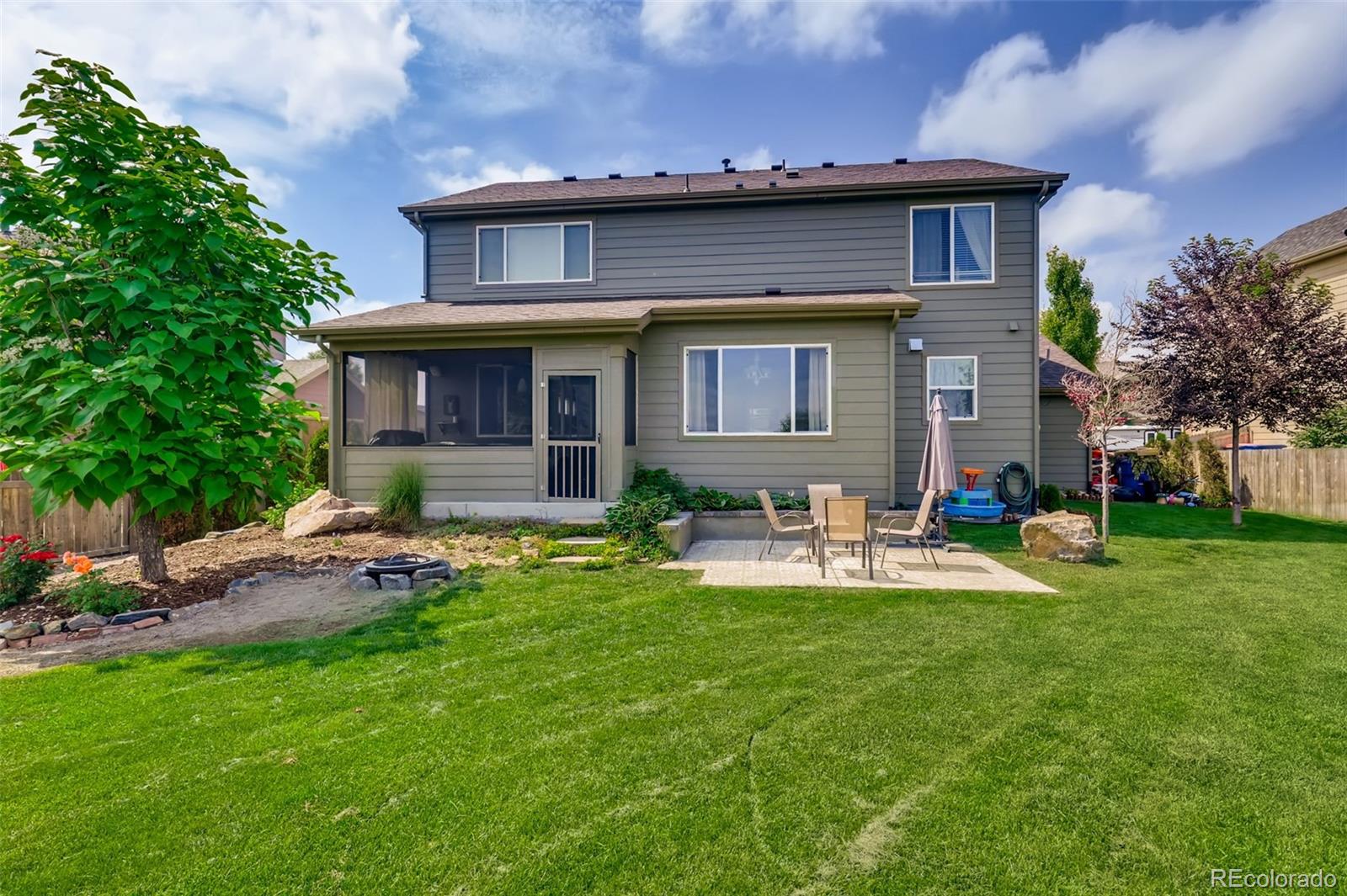 8537 Raspberry Drive Frederick, CO 80504 - Photo 27 of 31 a view of a house with a yard and sitting area