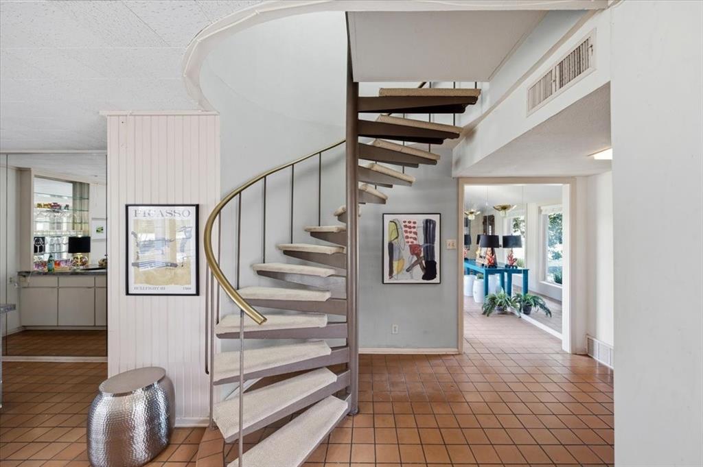 6321 Greenway Road Fort Worth, TX 76116 - Photo 27 of 40 Staircase featuring tile patterned floors and baseboards