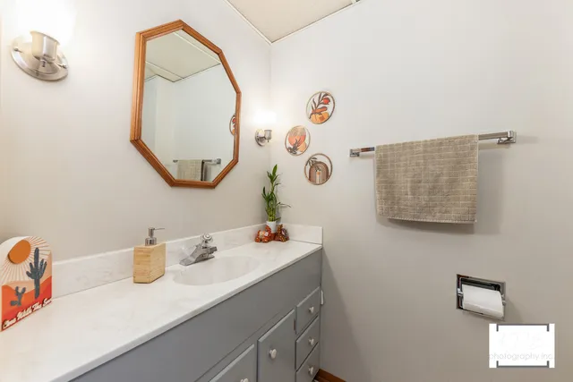 a bathroom with a sink and a mirror