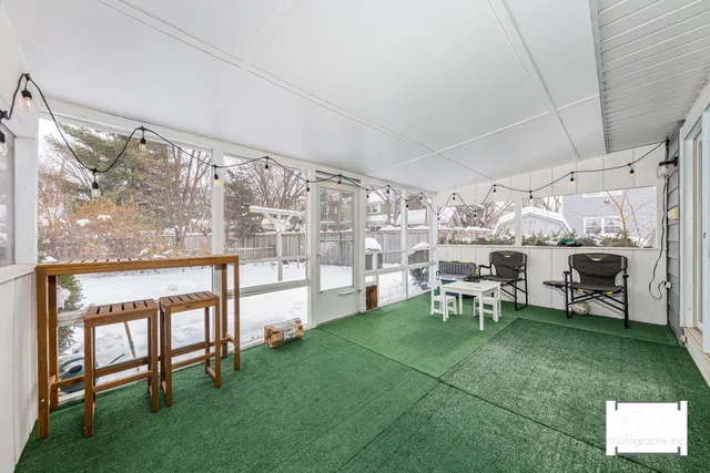 a living room with a large window and a table