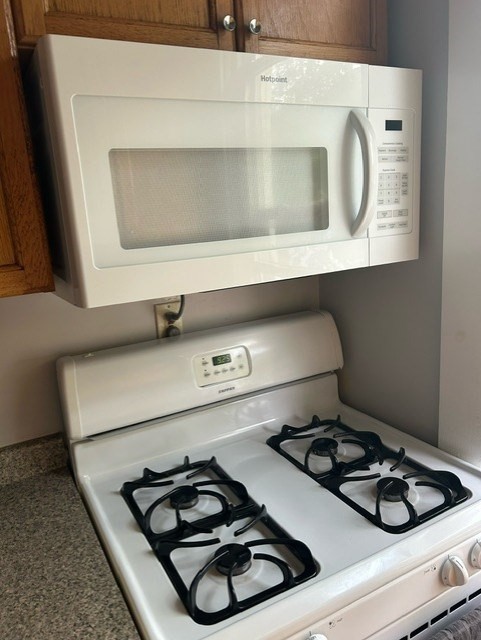 516 Union Street, Unit 2 New Bedford, MA 02740 - Photo 8 of 11 a stove top oven sitting inside of a kitchen