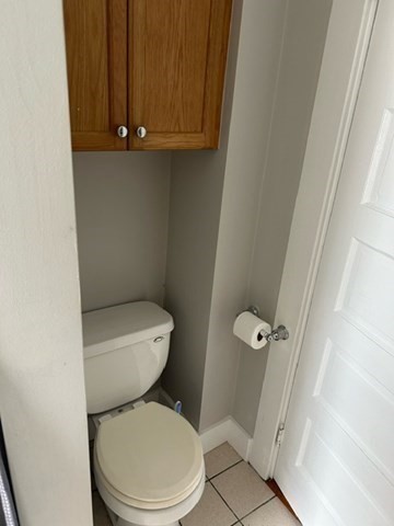 516 Union Street, Unit 2 New Bedford, MA 02740 - Photo 9 of 11 a white toilet sitting next to a shower