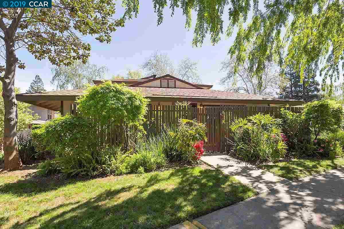 5508 Roundtree Drive, Unit F Concord, CA 94521 - Photo 1 of 1 a front view of a house with garden
