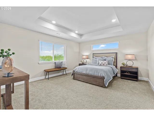 a bedroom with a bed and a table in it