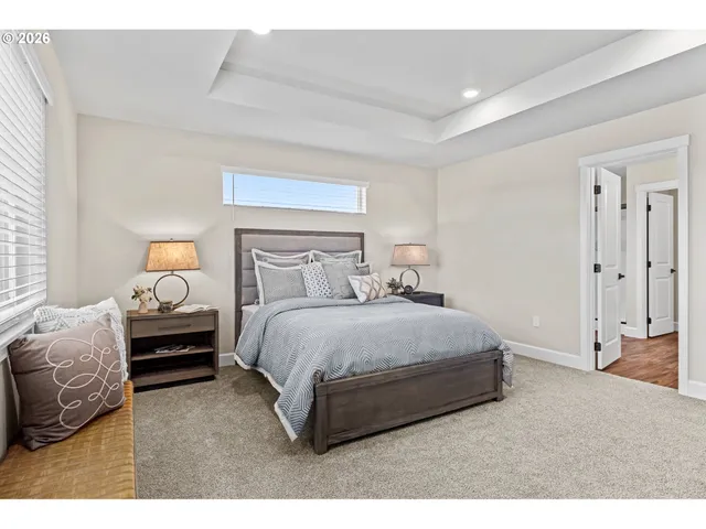 a bedroom with a bed and window