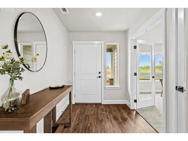 a bathroom with a sink a mirror and a shower
